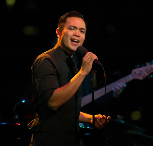Photo of Jose Llana singing