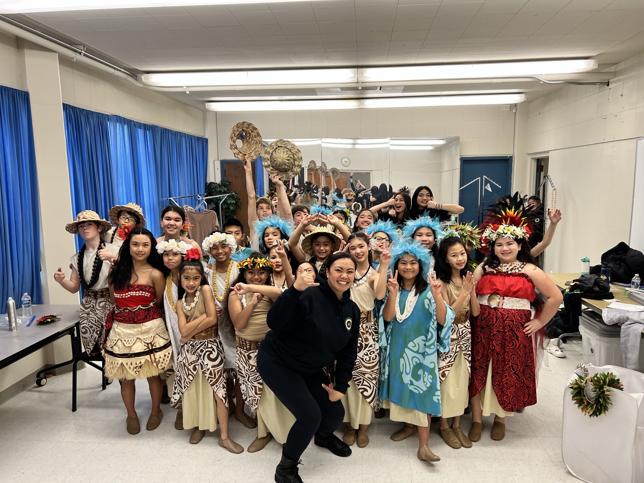 Photo of Marilou Lafon with her students in costume for Moana JR.