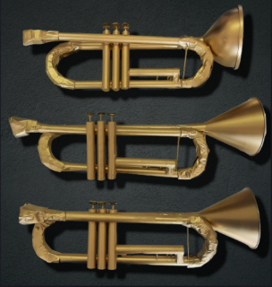 Three golden handmade trumpets in a greyish-black background