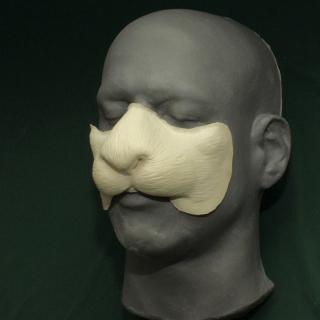 Rabbit Nose foam latex prosthetic, can be used for both the white rabbit and march hare A foam latex rabbit nose prosthetic placed on a platic human face cast.