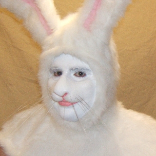 Rabbit Nose foam latex prosthetic man wearing prosthetic makeup and a costume hood to look like a white rabbit.