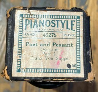 End of the player piano roll box with the title of the song