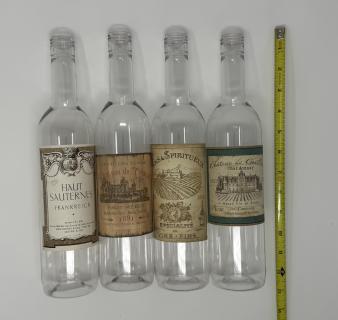 Four wine bottles with french labels