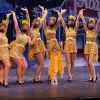 6 high school dancers posing in Bushel and a Peck costumes